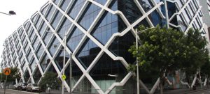 A glass wall building with steel designs