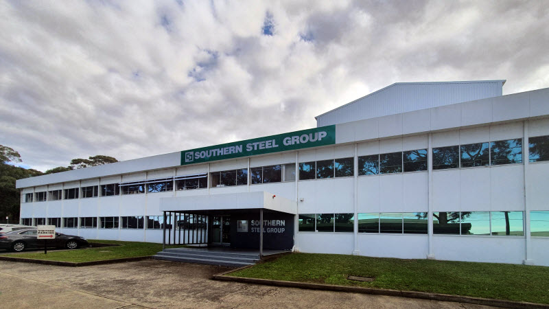 Outside view of a white Building of Southern Steel Group